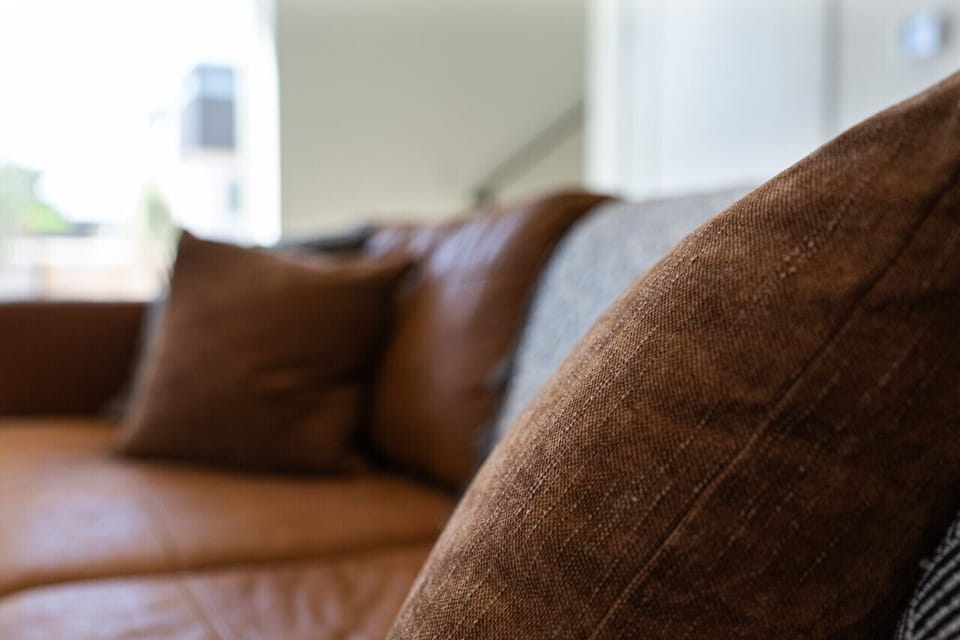 Cozy seating with plush pillows, adding comfort and style to the space.