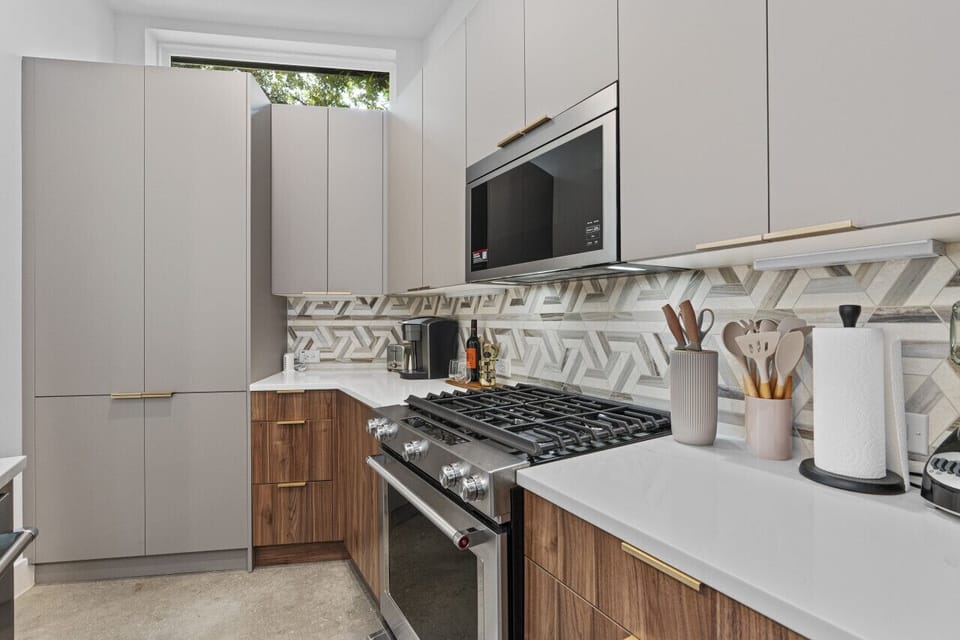 Bright kitchen with a stylish island and contemporary appliances ideal for cooking and entertaining.