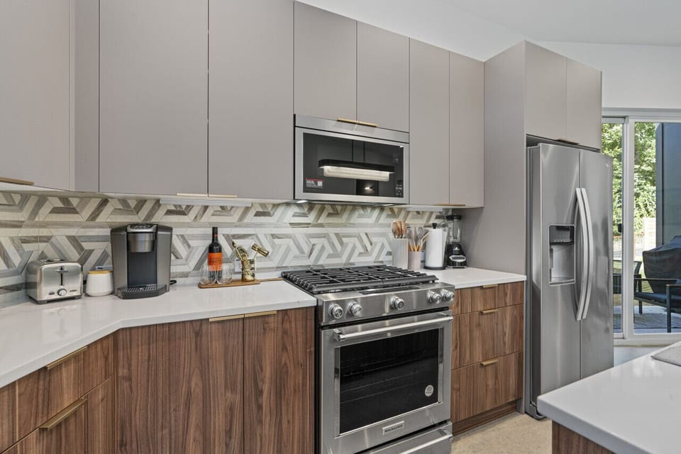 Charming kitchen featuring a spacious island and modern appliances perfect for family meals.