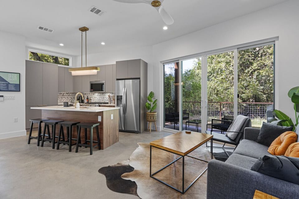 Spacious open concept living area that blends the living room, dining space, and kitchen for seamless entertaining.