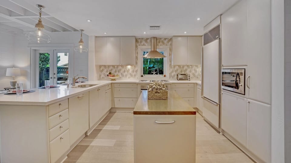 The state-of-the-art kitchen is absolutely stunning, with custom cabinetry and commercial grade appliances...