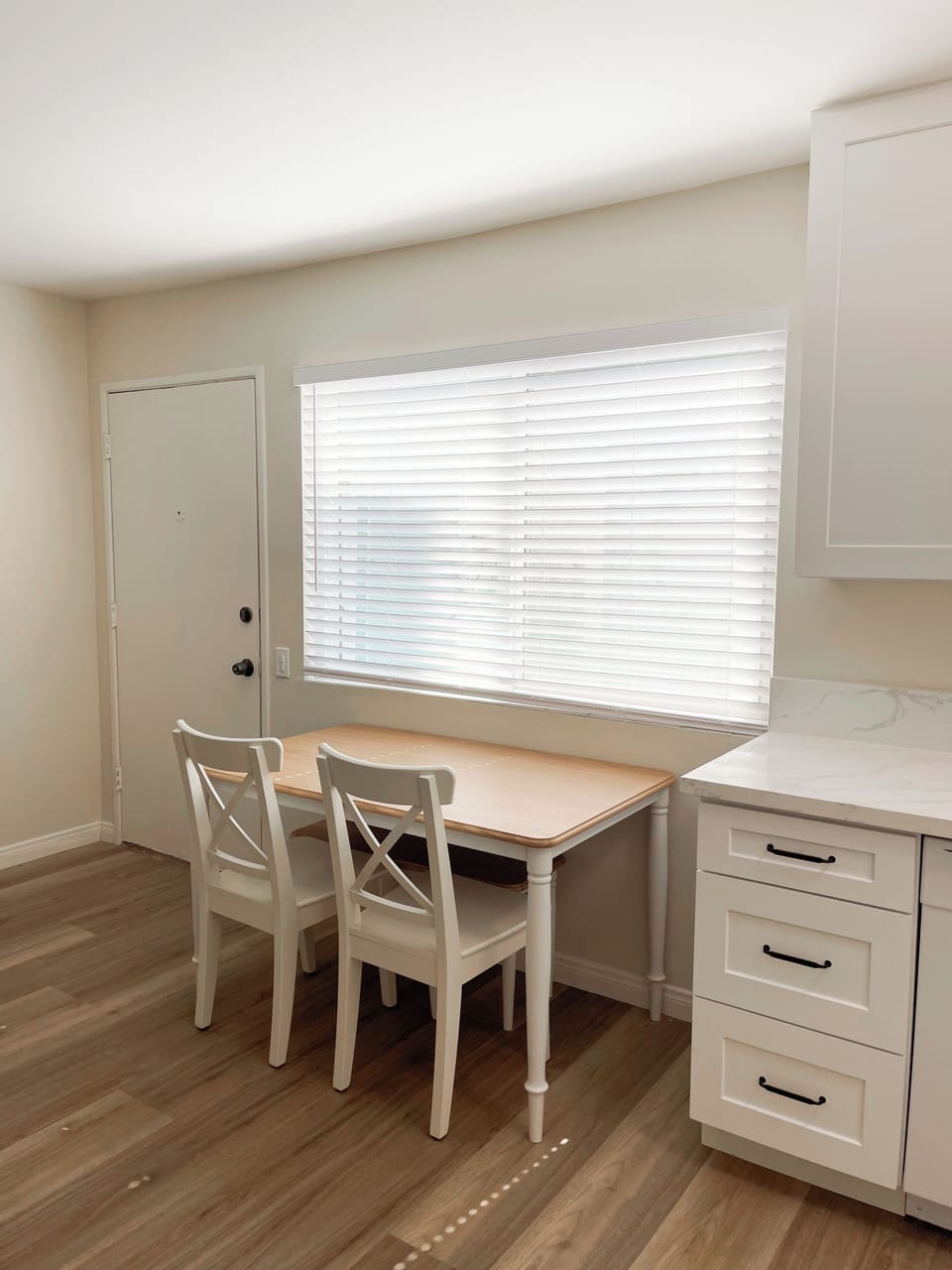 Dining table with 2 chairs and a bench to seat 4 people.
