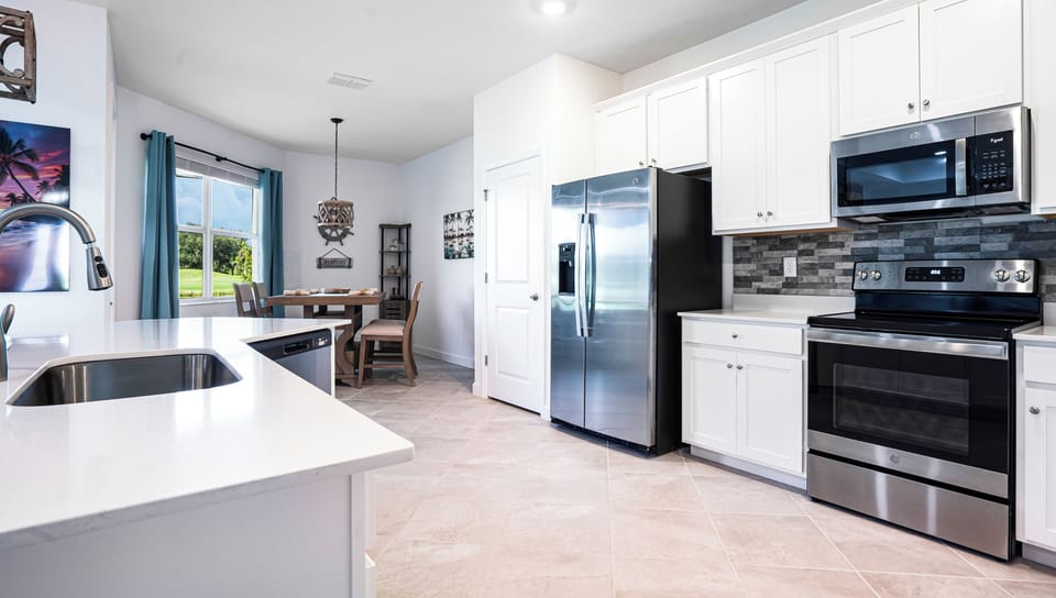 Full kitchen with new modern appliances, stove, oven, microwave & quartz counter