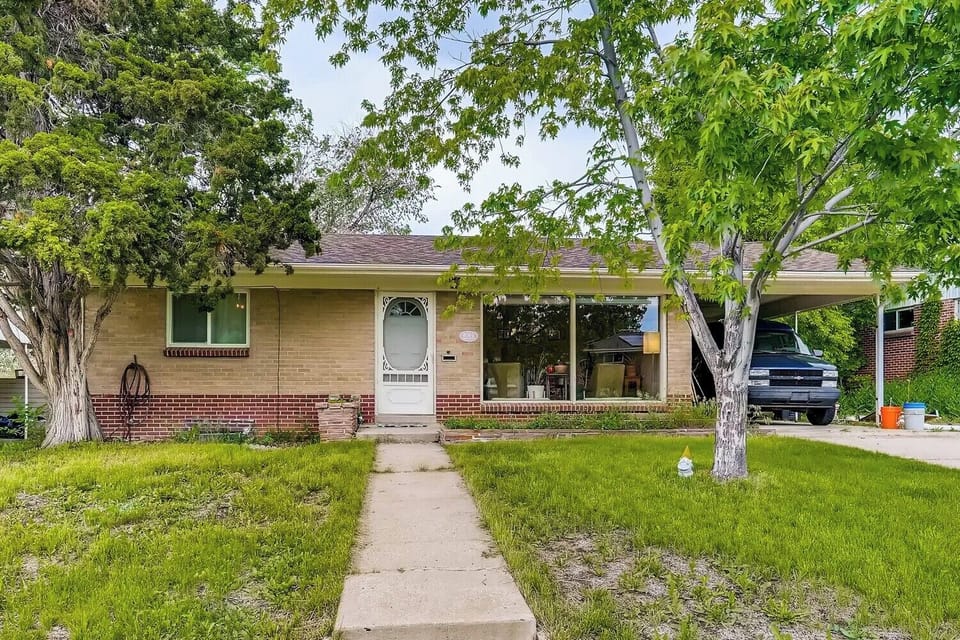 Front view of house w/ Carport
