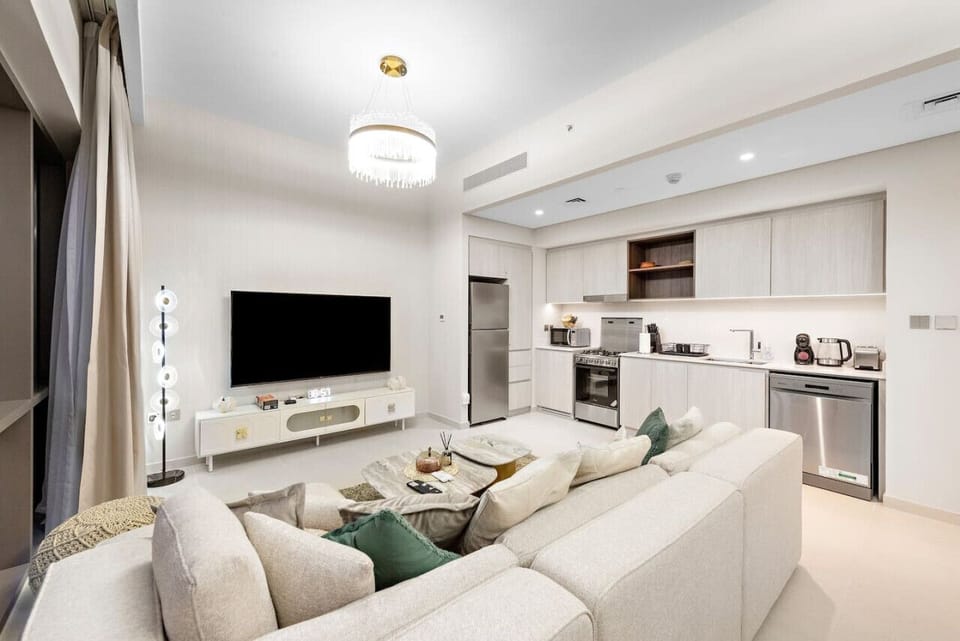 Living Room: Bright and inviting space with modern furnishings and a chic open kitchen!