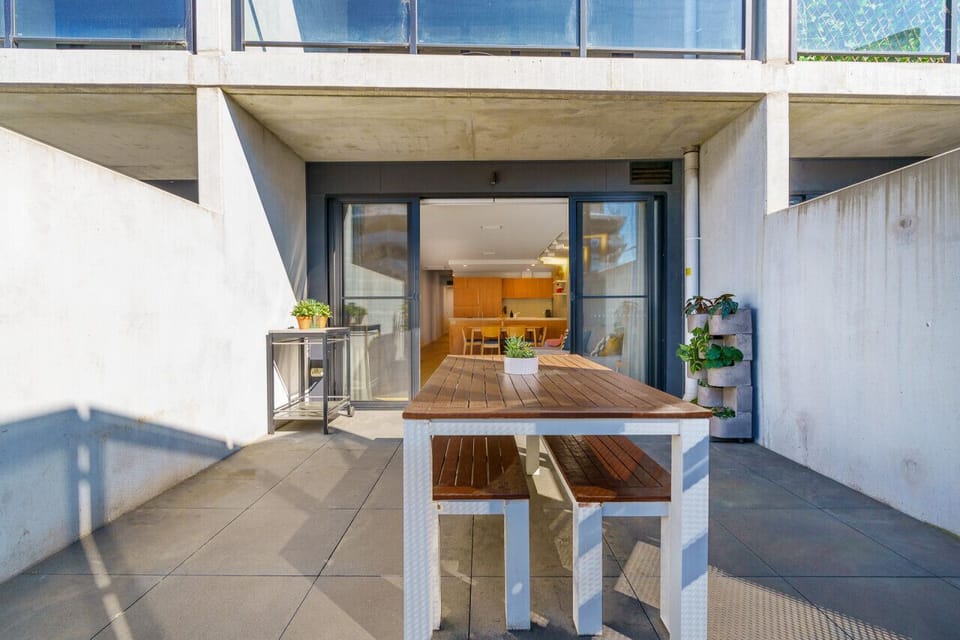 Relax in the courtyard with comfortable seating, perfect for enjoying the fresh air and the view of Lonsdale Street.