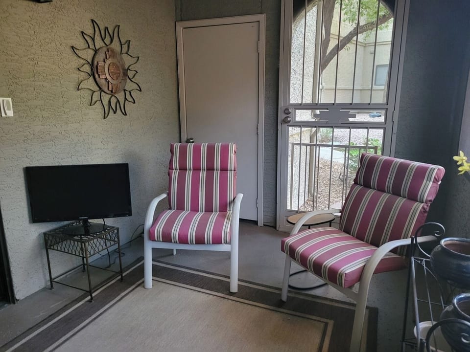 Private screened-in patio with amble seating