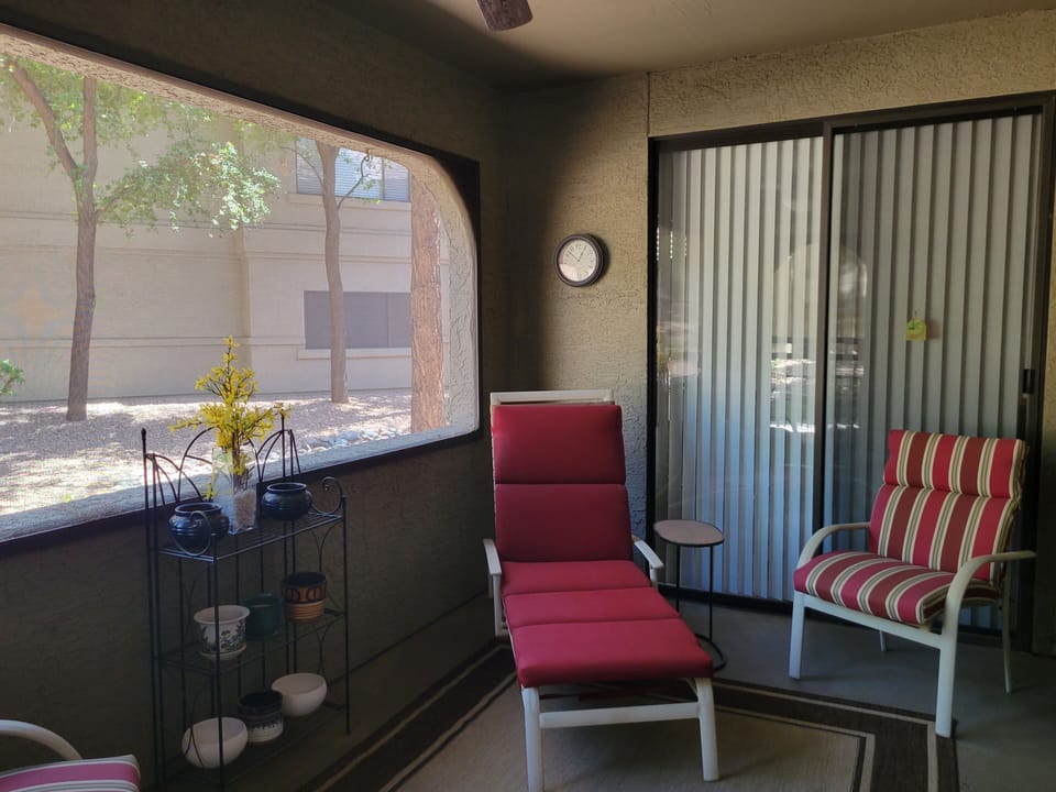 Private screened-in patio with entries from living room and master bedroom
