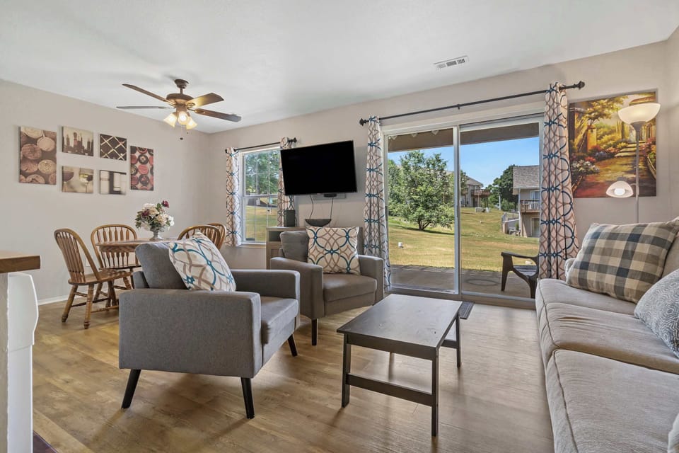 Spacious living room with access to patio