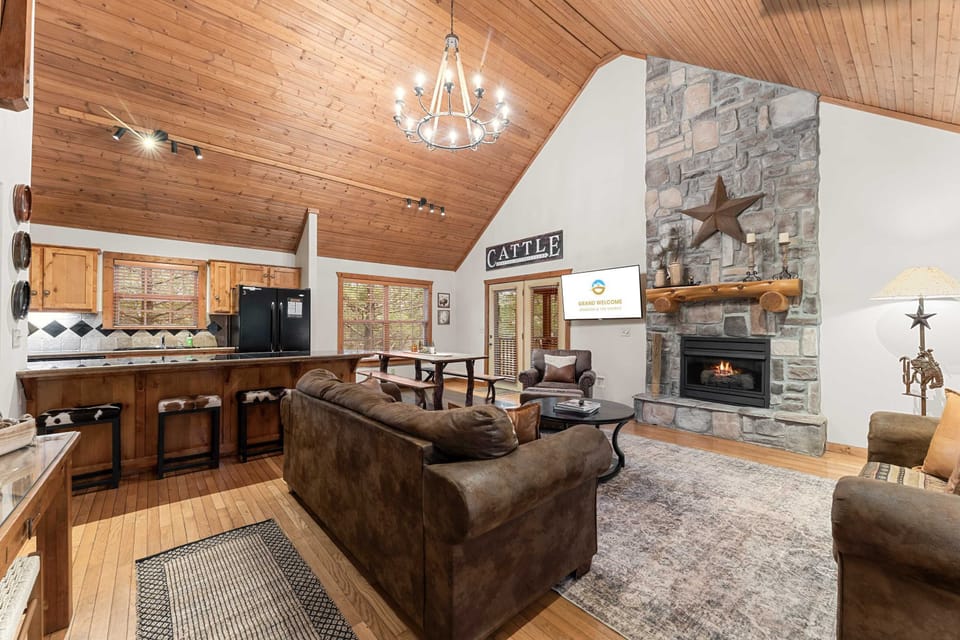 Spacious open living space with Smart TV, fireplace, and sofa sleeper