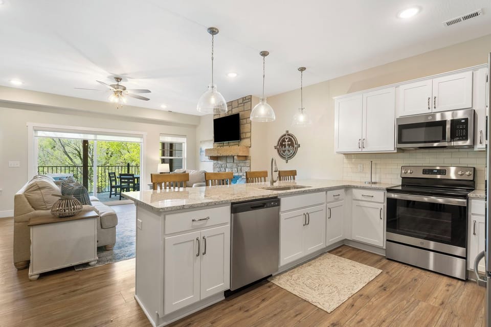 Enjoy views of Lake Taneycomo from every angle in the open Living/Dining/Kitchen areas