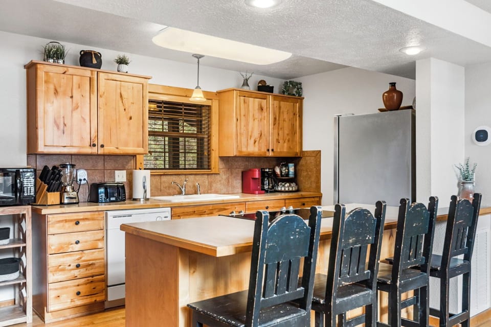 Your open kitchen offering wonderful conveniences and counter seating for 4