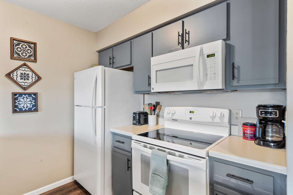 The airy kitchen offers ample space & all the comforts of home