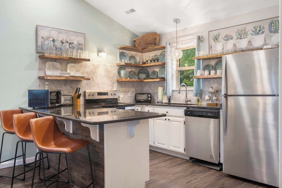 Enjoy tranquil finishes and all the comforts of home in the beautiful open Kitchen
