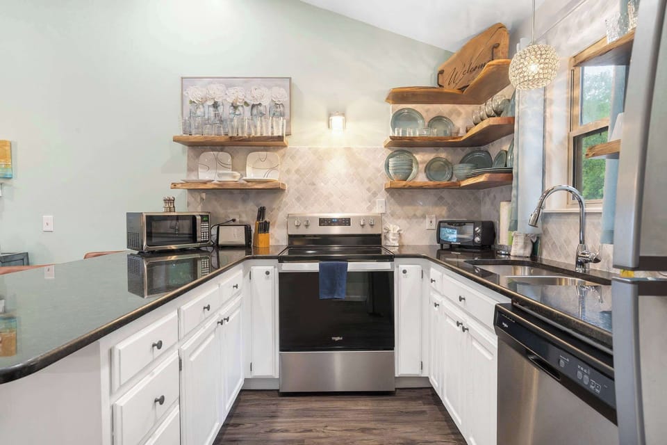 Enjoy tranquil finishes and all the comforts of home in the beautiful open Kitchen