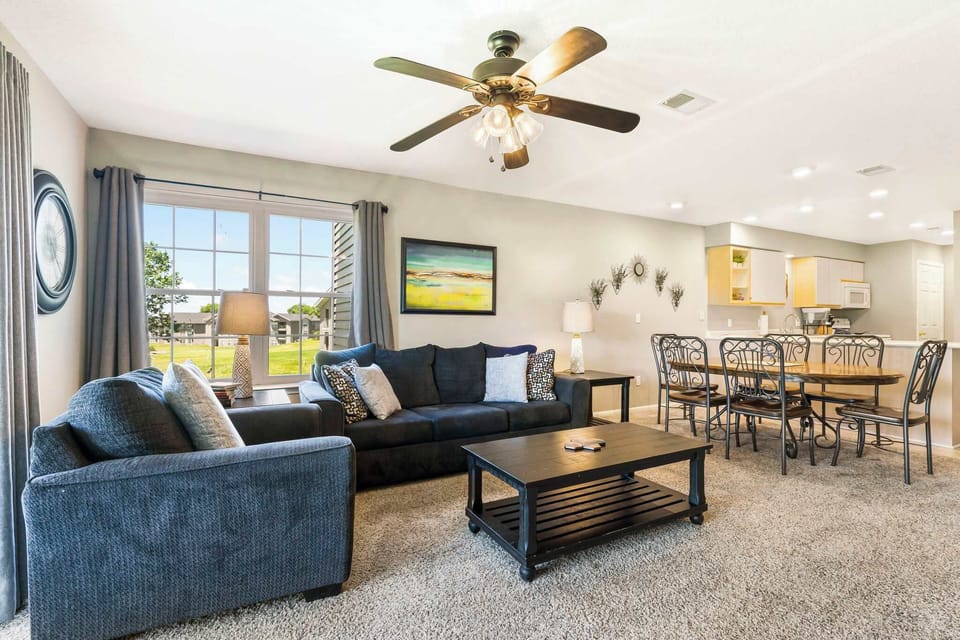 Cozy and spacious living area with TV
