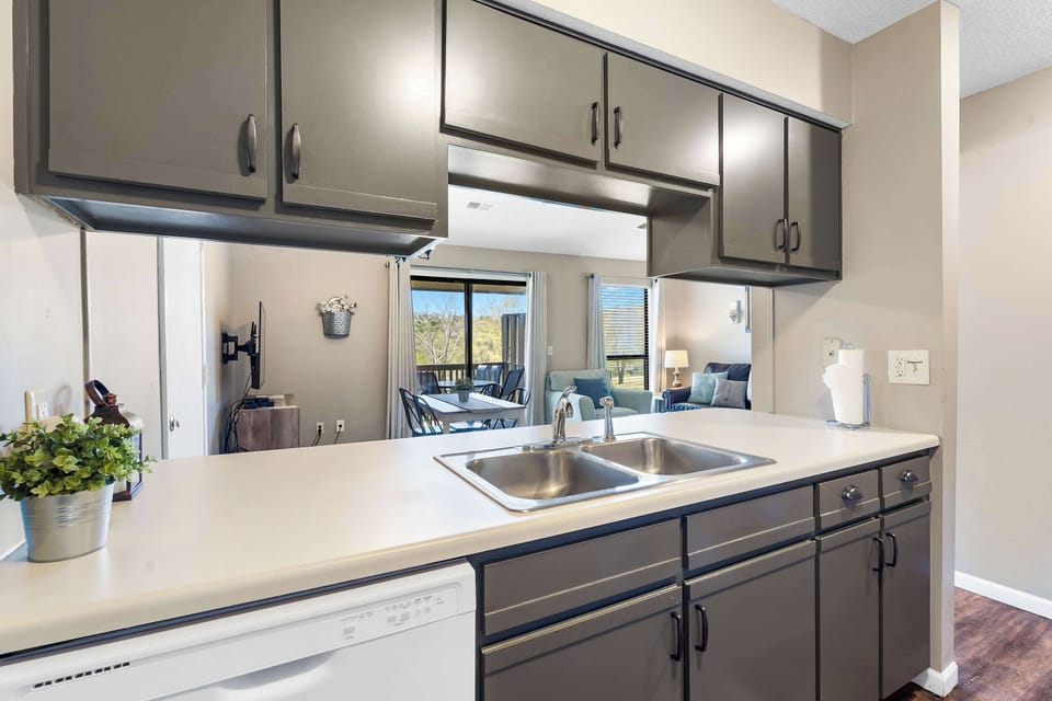 The open, airy kitchen offers ample space & all the comforts of home