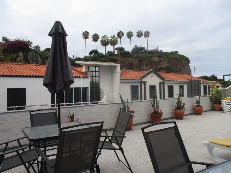Open relax  area with showers hot and cold water,relax table,sun cheer