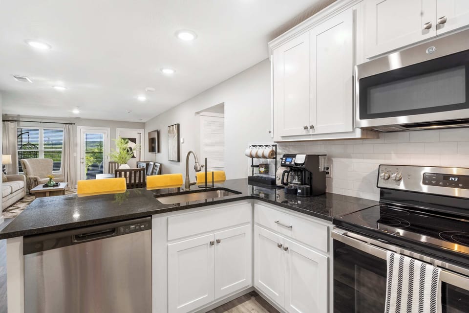 The open, airy kitchen offers ample space & all the comforts of home