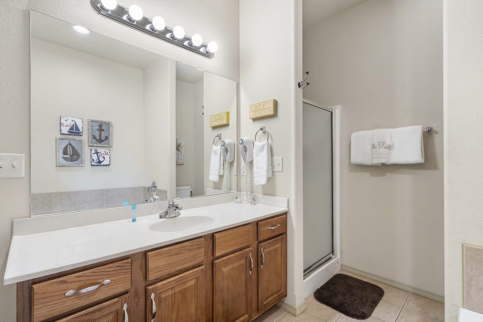 Master en-suite master bathroom with jet tub and stand-in shower
