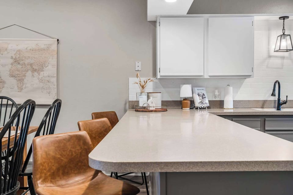 Kitchen bar counter with additional seating for 3