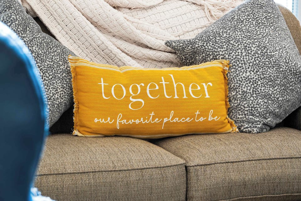 Spacious living room with balcony access TV, and Queen size sofa sleeper