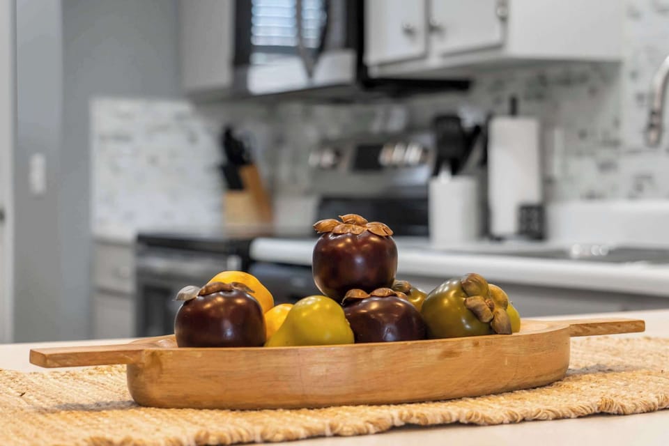 Unit 19: The sleek, updated kitchen is spacious & well-equipped for your visit