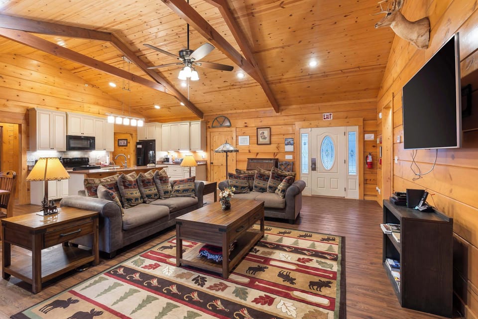 Open living space with a queen sofa sleeper, Smart TV, and gas fireplace