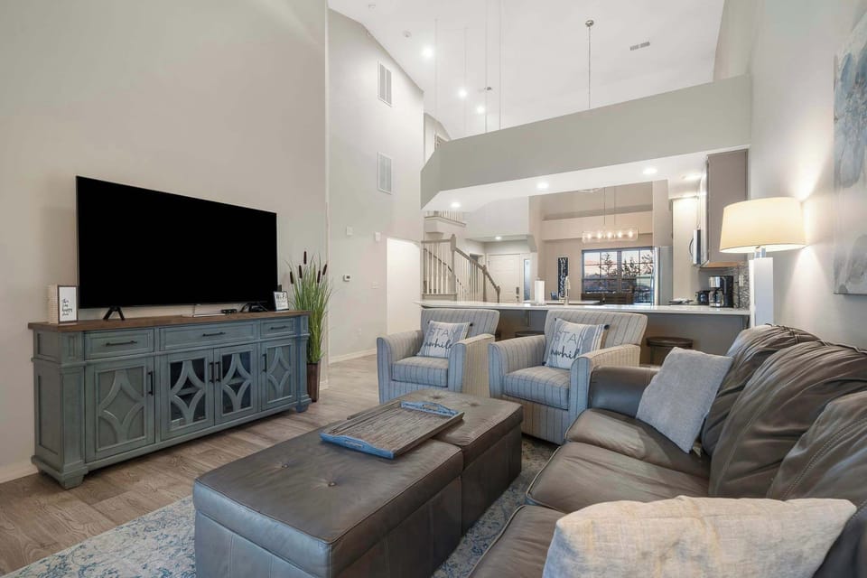 Cozy and spacious living area with TV