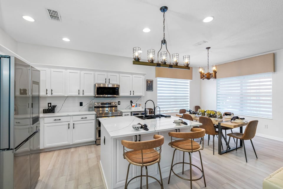 The kitchen is equipped with kitchen island with bar seating for 2