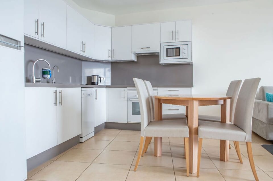 Functional dining area adjacent to the kitchen, a perfect spot for family meals and socializing.