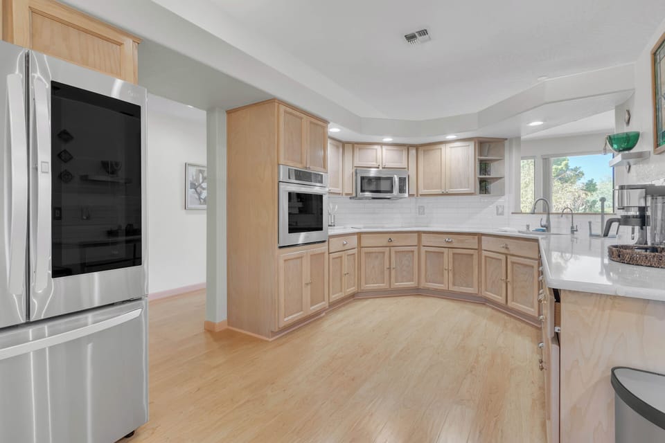 Kitchen is completely outfitted with stainless steel appliances