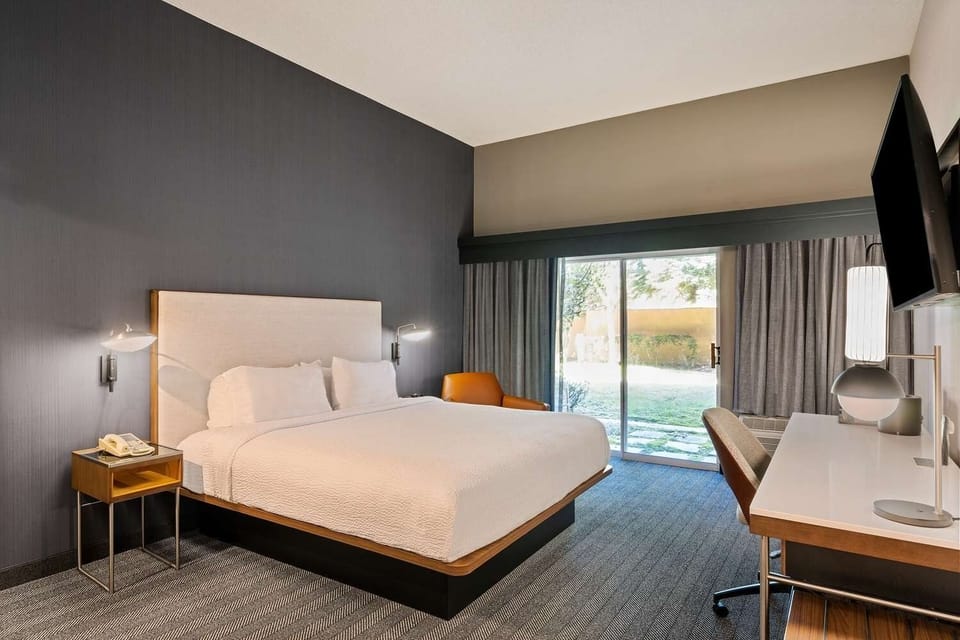 Sink into crisp linens and enjoy a calm, modern retreat.