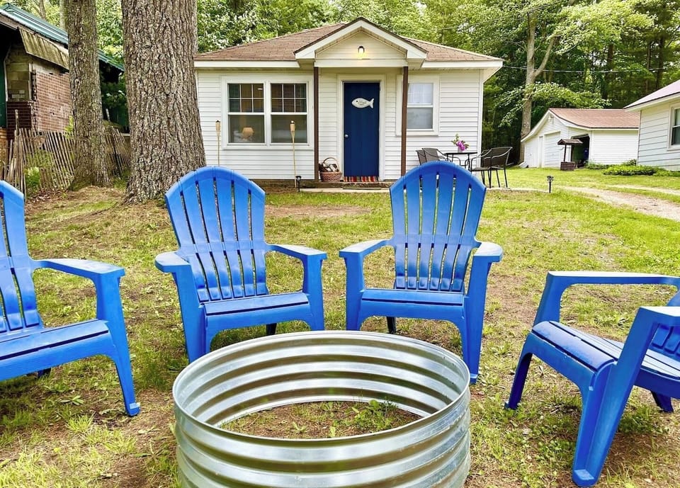 OVERALL:  The front of the cabin and the fun and family-friendly bonfire ring in the front yard.