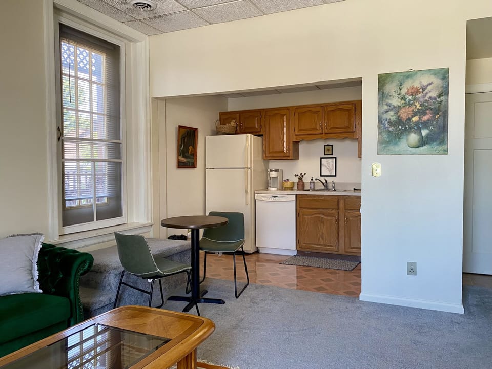 View from the hallway into the living room and kitchen. 