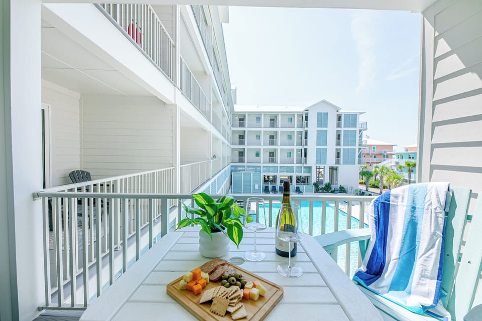Enjoy the pool view from the balcony
