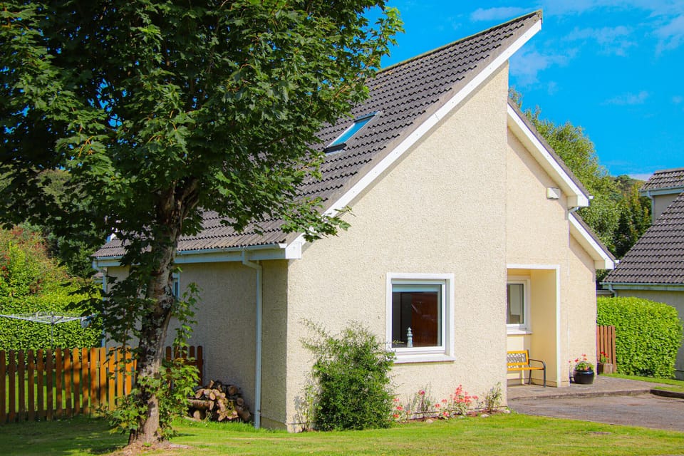 Exterior of Dunmore Villas holiday  home in Dunmore East, Co. Waterford, Ireland. Seating outside, sunny well maintained garden