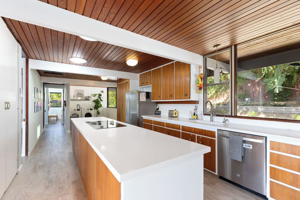 Enjoy our fully-equipped chef's kitchen, complete with brand new appliances including a microwave, garbage disposal, and full-size oven. You'll also find a spacious pantry and a convenient full-size washer and dryer. Feel at home and prepare meals with ease in this well-appointed space