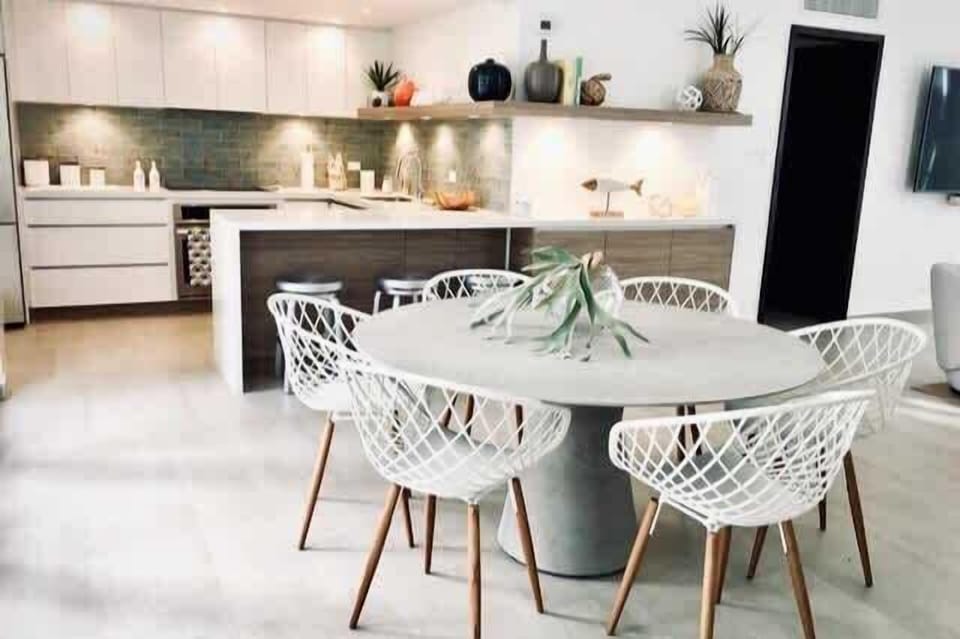 Adjoining the kitchen
Seats 6 around a round wooden table
Sideboard
Large window with door leading to outdoor living space
Bathrooms x 4 plus one in the Studio:
All modern-chick, uniquely stylish bathrooms