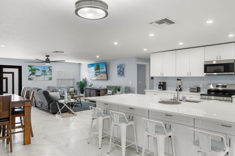 Open-concept lounge offering comfortable seating and modern coastal decor.