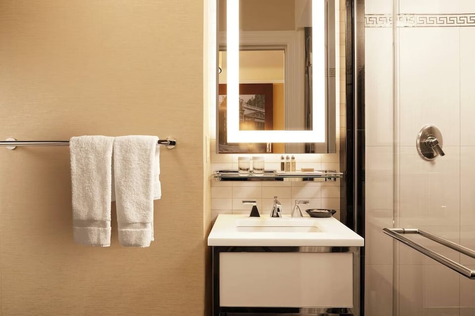 Start your day with glowing mirror light and fresh towels.