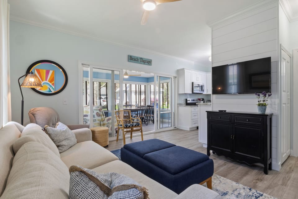 Living room with AC, Queen sleeper sofa and smart TV.