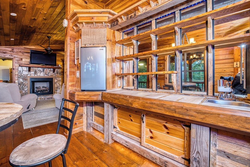 Enjoy late-night drinks at the bar w/ wine fridge, mini fridge, seating & more.