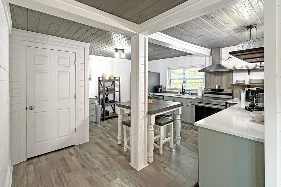 Modern fully stocked kitchen with additional seating area for 4