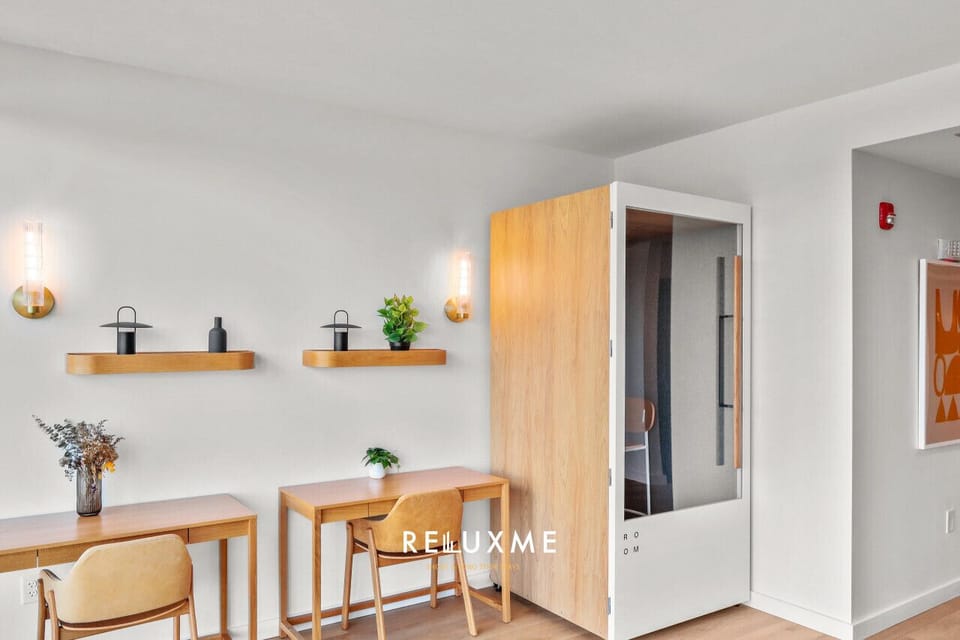 Work remotely in style with access to a well-equipped co-working area featuring desks, call pods, and a kitchenette.
