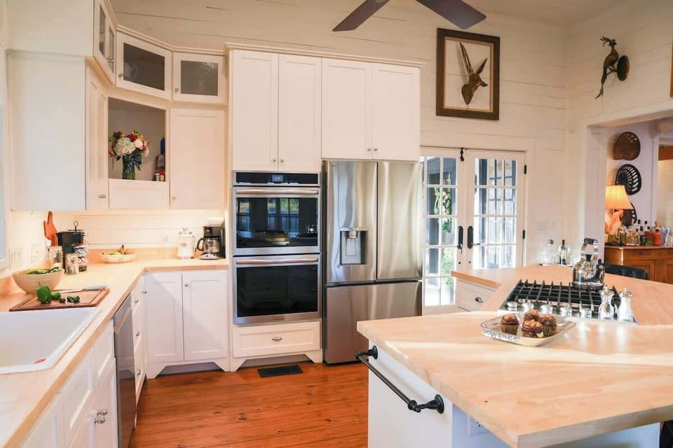 Main house kitchen with stainless steel appliances, including a double oven!