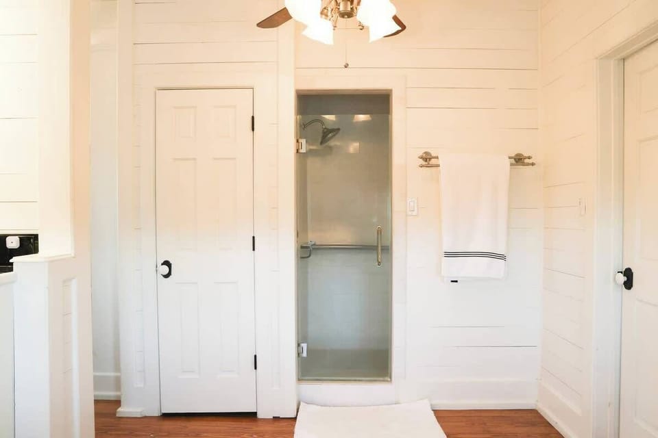 Walk in shower in the primary bathroom of the main house