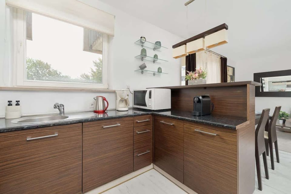 Kitchenette with two coffee machines.