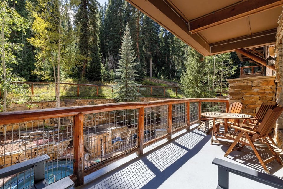 Unwind on your private balcony with forest views, where morning coffee tastes better surrounded by towering pines and peaceful serenity.