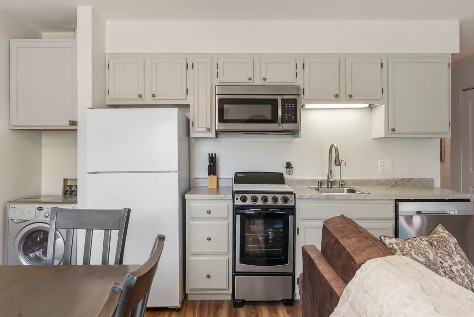Enjoy the convenience of Private Laundry, tucked away beyond the Kitchen